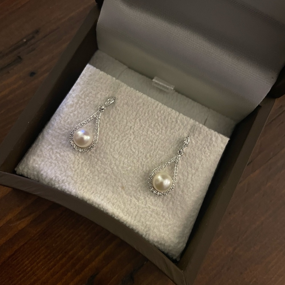 Never before worn Pearl and diamond earrings.